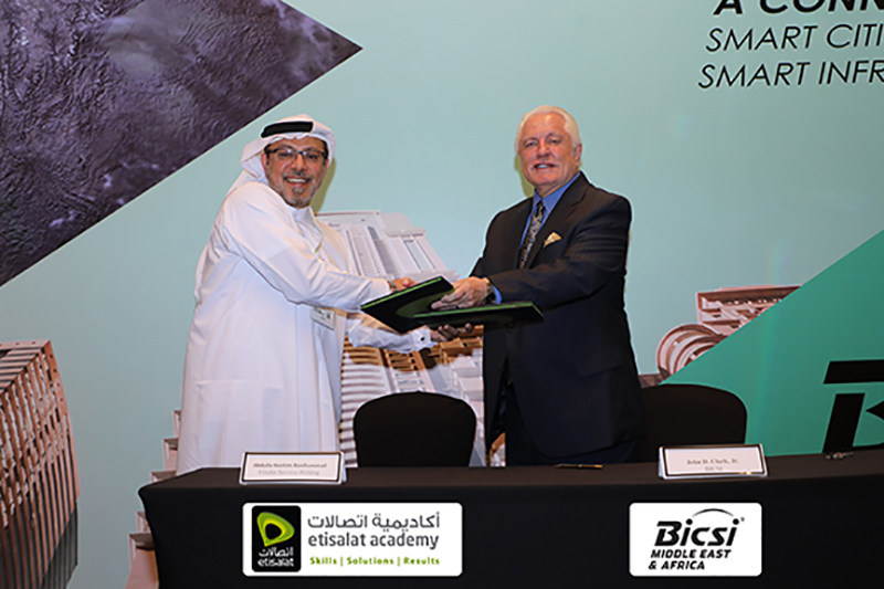 Shown completing the signing of the Etisalat Academy – BICSI ADTP agreement is Abdulla Hashim Banihammad, CEO, Etisalat Services Holding, and John D. Clark, Jr. Executive Director and CEO, BICSI.”
